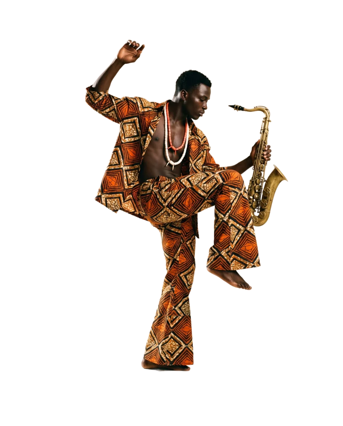 A man in an orange and black wax-print two-piece and coral beads, dancing with a saxophone