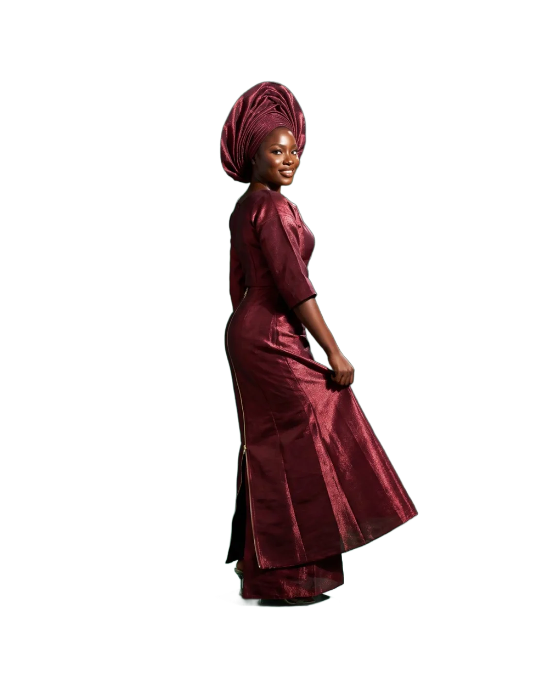 A woman in a wine-red aso-oke ìró and bùbá with a tall pre-tied gèlè