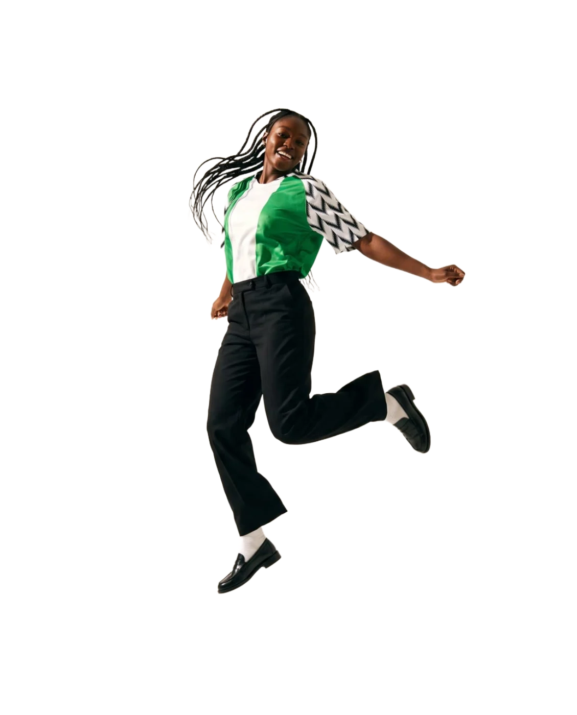 A woman jumping in the green and white Nigeria football shirt with feather sleeves